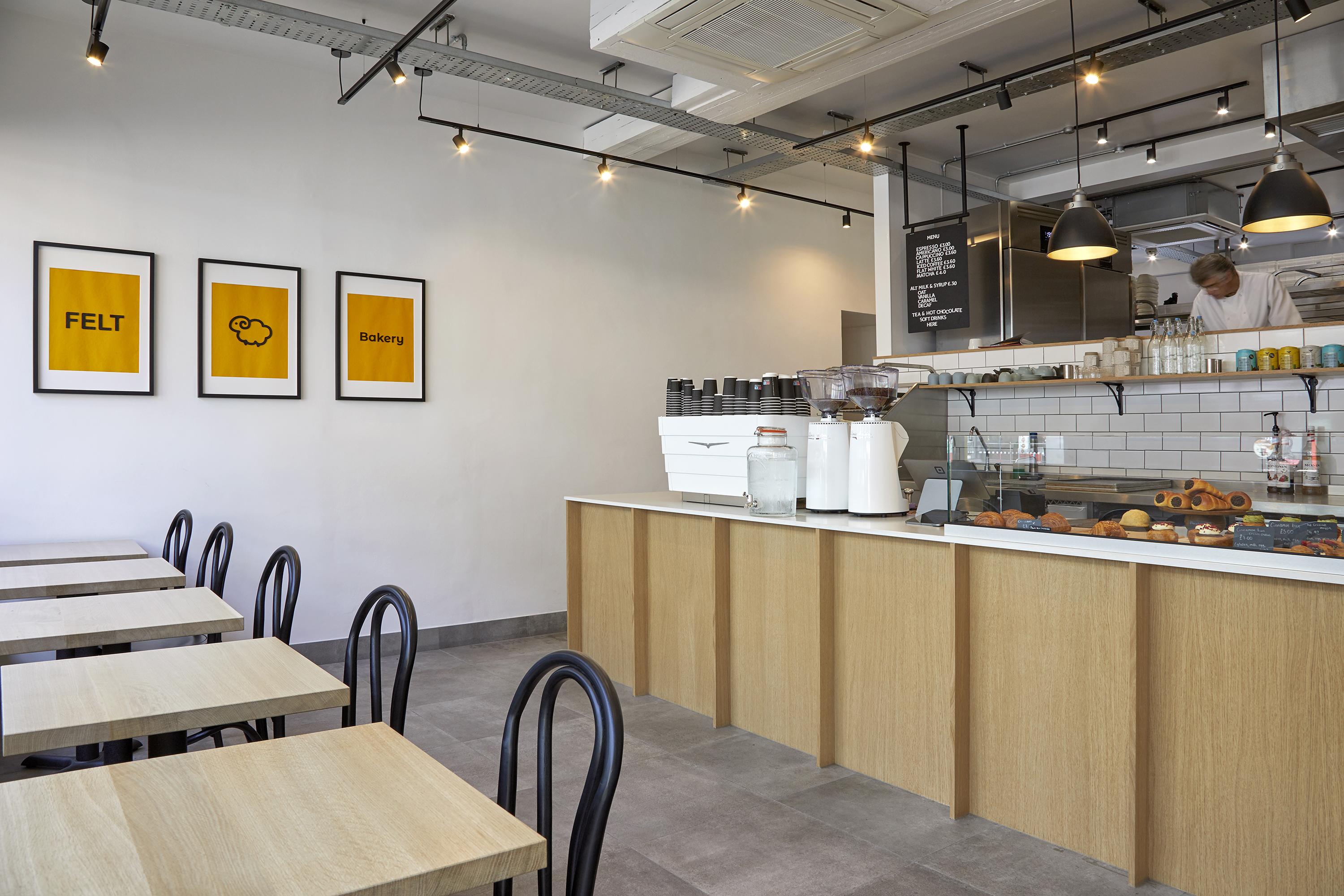 Felt Bakery interior with brand graphics, tables, and counter