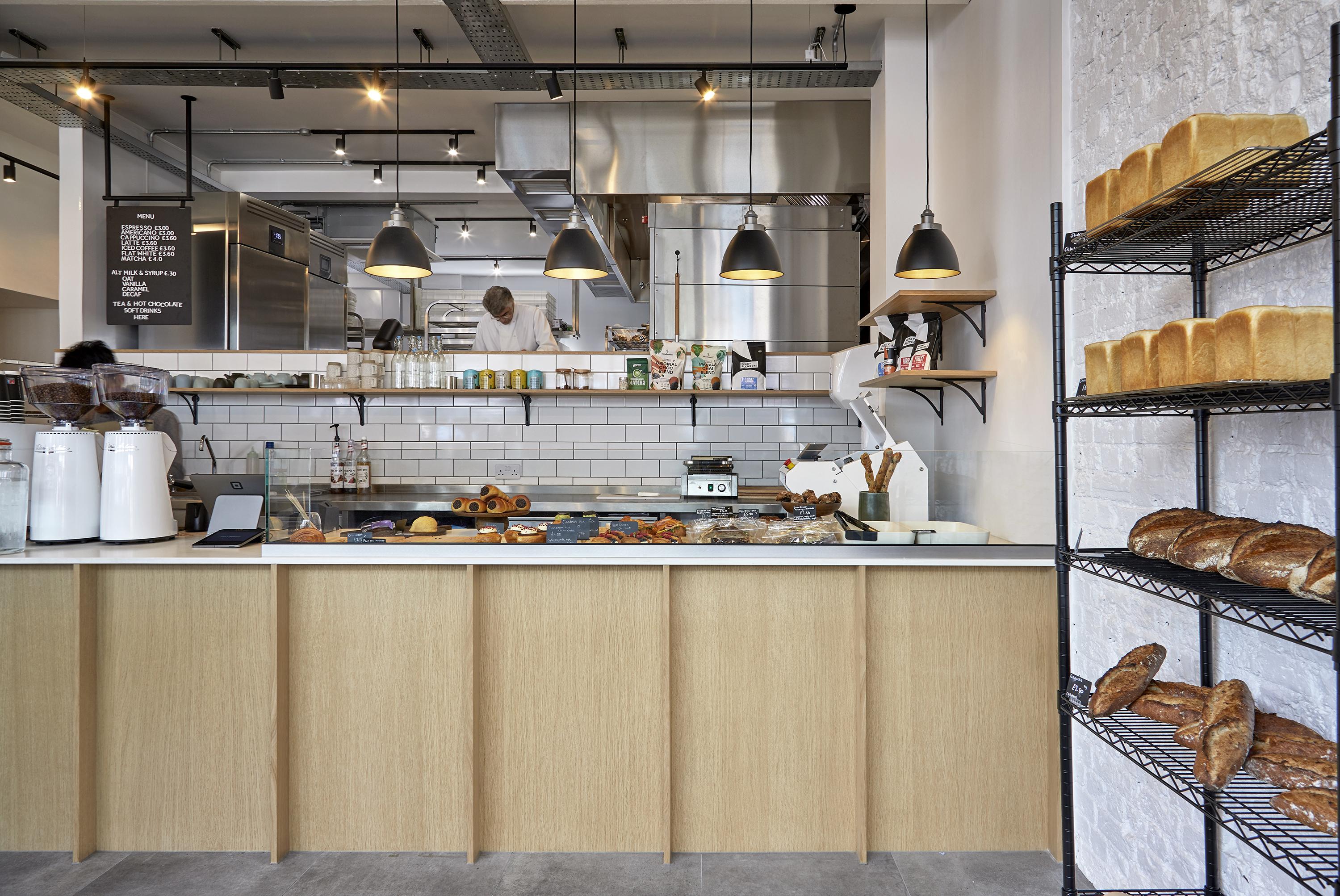 Felt Bakery interior with counter, bread display, and warm lighting